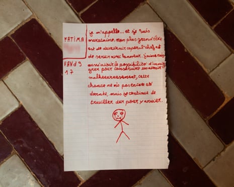 A handwritten letter, in red ink with doodles, from a teenage Moroccan girl who made the crossing to Ceuta.