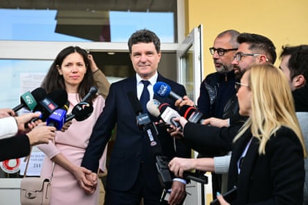 Nicusor Dan and his wife Mirabela Gradinaru give interviews as they leave after voting at a polling station. Dan campaigned against corrupt and illegal high-rise property development in Bucharest before becoming the Romanian capital’s mayor in 2020.