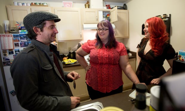 Polyamorous threesome, Jeff Lords, Gaile Parker, and Tamela Clover (from left to right), prepare a meal together at home in Portland, Oregon.