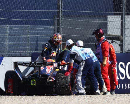 Marshals assistance Max Verstappen aft crashing his Red Bull