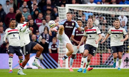Ross Barkley battles for the ball with Jonny Evans