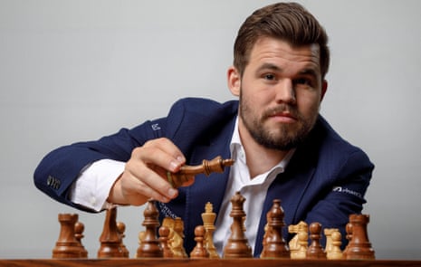 Magnus Carlsen, the chess world champion from Norway, taking part in simultaneous games with 21 opponents at the Four Season Hotel - he beat them all in just over an hour.