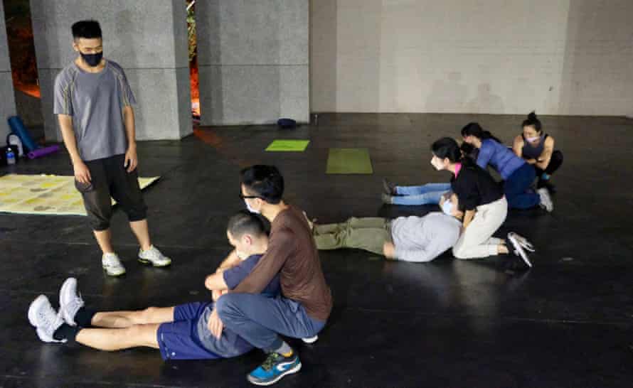 A grassroots community group trains for disaster at a city park in Taipei