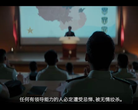Soldiers watching a speaker on a podium in front of a map of China