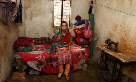 Bangladeshi garment worker Shima, 26, at her home in Dhaka. Shima lost her foot to infection and now wears a prosthetic. An Oxfam report found women who work for Australian brands are unable to feed their families or get treatment when ill. 