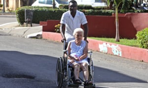 A health worker helps a lady in a wheelchair at the Calixto Garcia hospital, in Havana, Cuba, on Wednesday. Cuba reported that it is withdrawing from the More Doctors in Brazil due to the ‘threatening and derogatory’ words of President-elect Jair Bolsonaro. 3994.jpg?width=300&quality=85&auto=forma