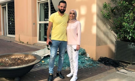 Israa Seblani poses for a picture with her husband Ahmad Subeih in Beirut in the same place where they were taking their wedding photos when the blast rocked the city.