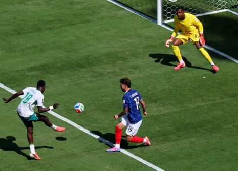 Senegal's Ismaila Sarr misses a chance to score by hitting the ball over the bar.