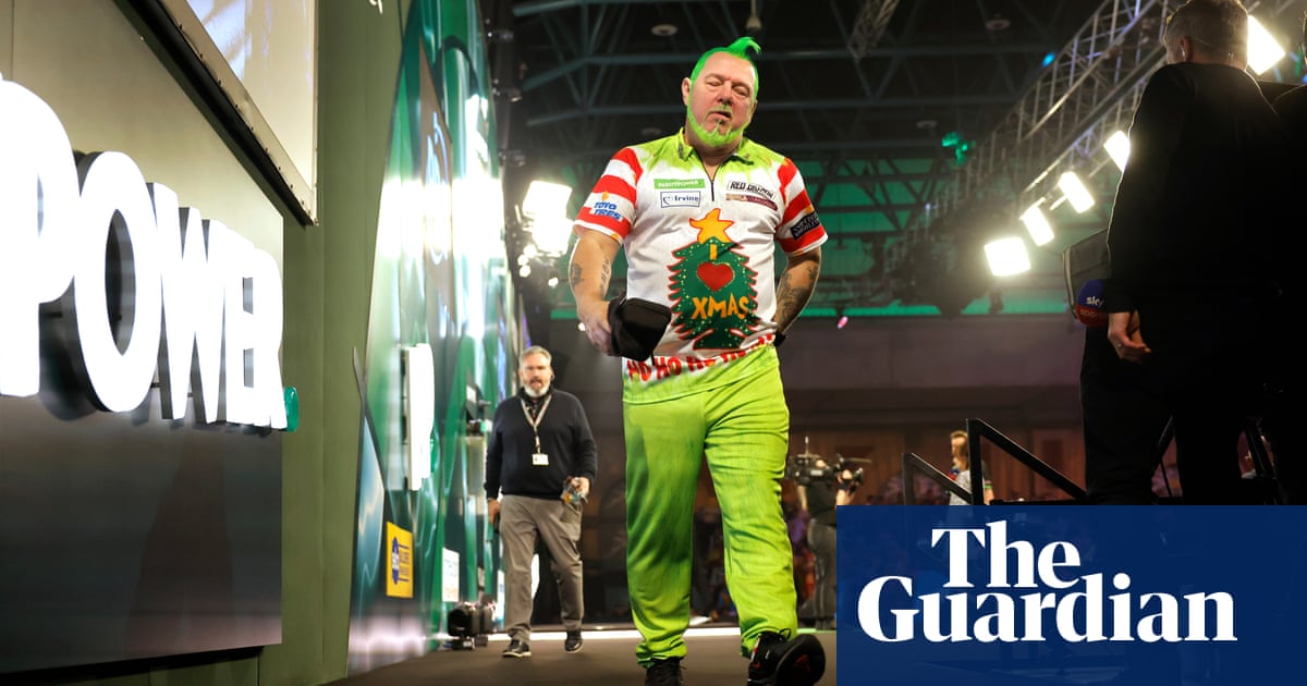 PDC world darts: Peter Wright beaten by Jim Williams, Luke Littler lights up oche - The Guardian