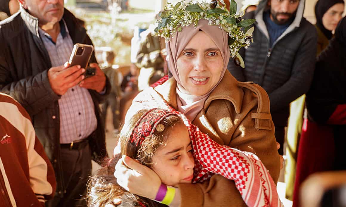 Freed Palestinian prisoner Nidaa Zaghebi embraces her daughter after her release from an Israeli jail