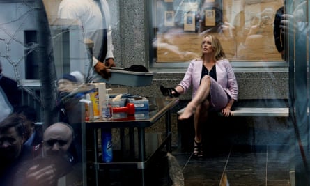 Stormy Daniels puts her shoe back on after passing through security in Manhattan federal court in April 2018.