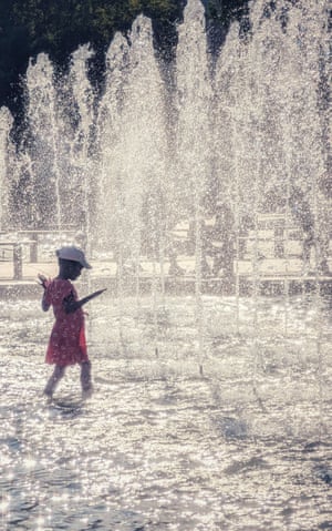 Strasbourg, France ‘A girl plays in a fountain in the city centre during a particularly hot spell.’
