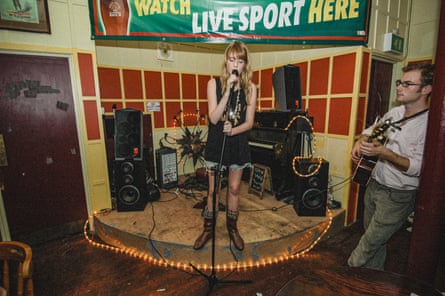 Florence Welch singing into a microphone at the Devonshire Arms in north London, 2005.