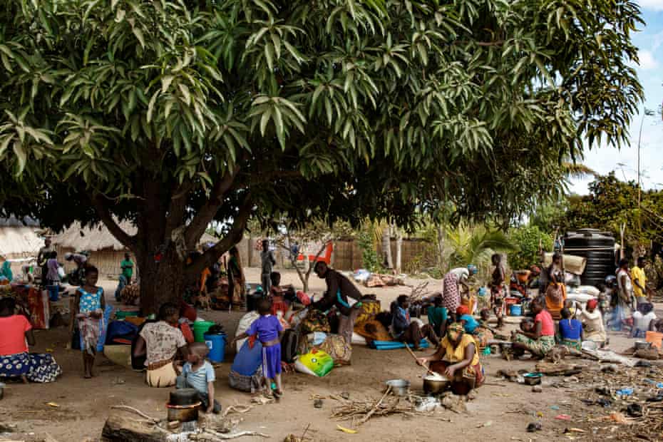 New arrivals, displaced by the conflict wait at the entrace of Ntele resettlement area, which is full - near Montepuez, Cabo Delgado.