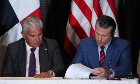 Panama’s president, José Raúl Mulino, looks on as Pete Hegseth, the US defence secretary, signs a bilateral agreement, in Panama City on 9 April 2025.