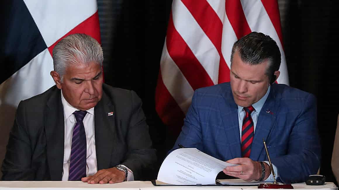 Panama’s president, José Raúl Mulino, looks on as Pete Hegseth, the US defence secretary, signs a bilateral agreement