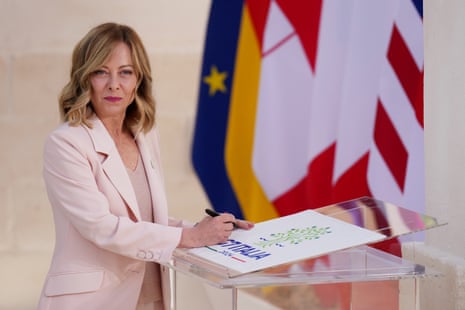 Italian prime minister Giorgia Meloni waits for the arrival of other G7 leaders.