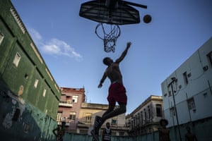 People play at a basketball court in Havana, Cuba