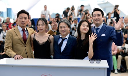Director Park Chan-Wook (centre) and his cast at the Cannes film festival photocall for The Handmaiden