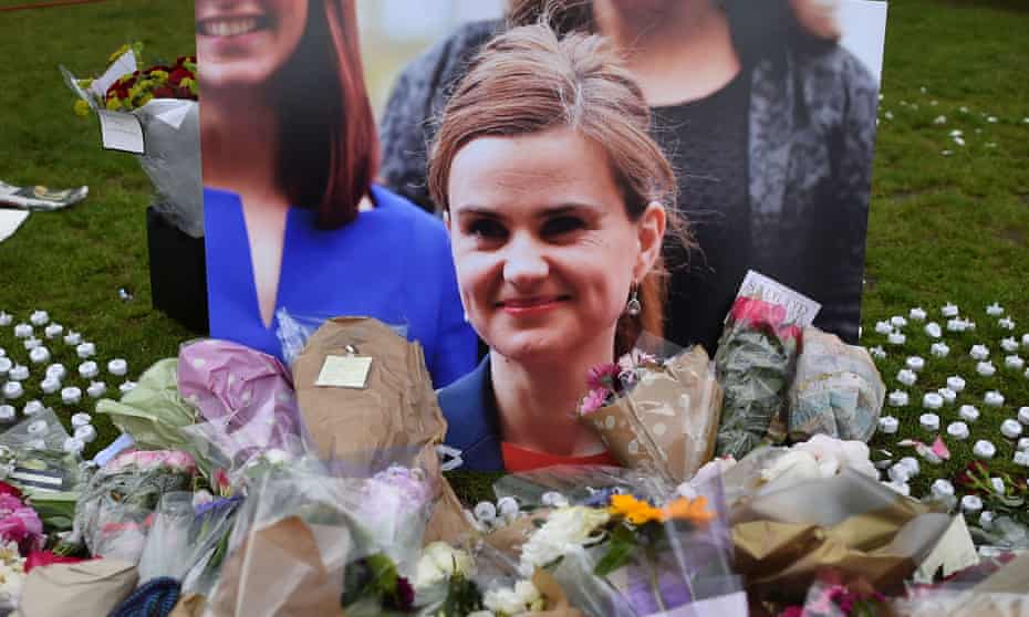 Flowers and tributes placed by a photo of Jo Cox in Parliament Square after she was killed.