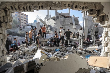 people standing in debris