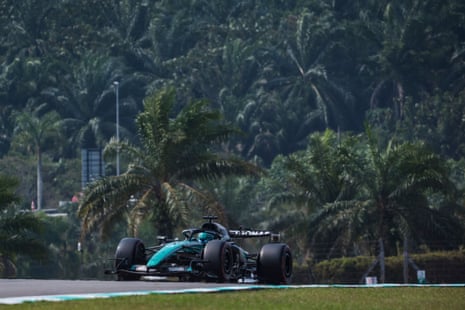 Fernando Alonso drives in his Aston Martin.