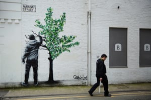 Mural of man painting a tree