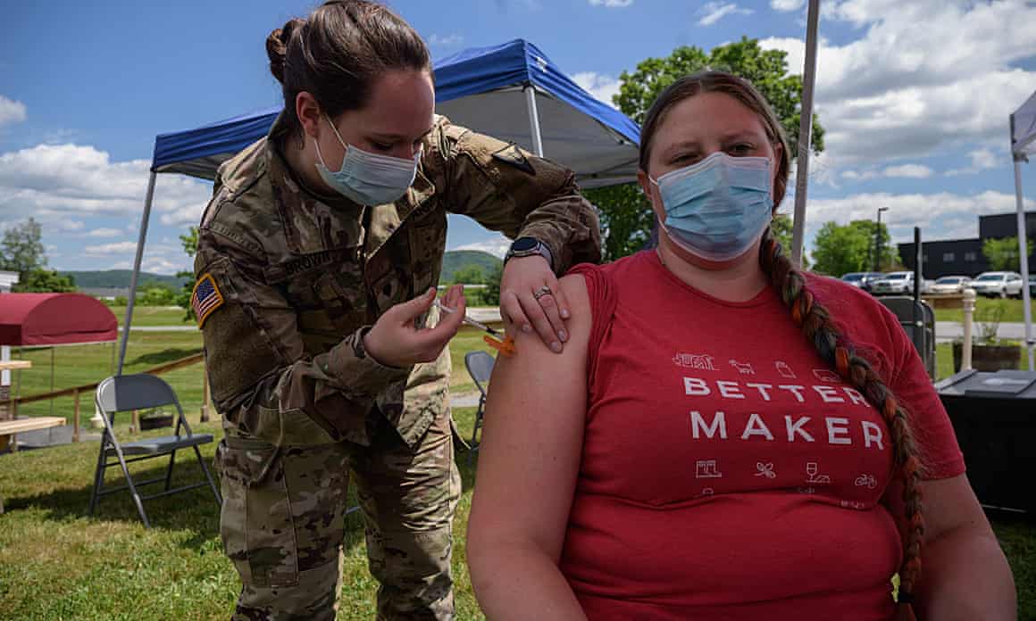 A national guard soldier administers vaccines at a creamery in Vermont