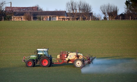 A farmer spreads pesticides on a field in Fromelles near Lille, France