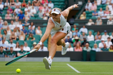 Mirra Andreeva lunges for the ball against Magda Linette