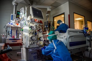 Nurse operates medical equipment