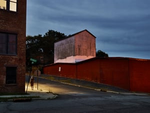 Jill in Newburgh, 2016Lynn Saville photographs cities between twilight and dawn, capturing transitional, often deserted urban spaces stripped of people. Her images focus on fundamental city elements–bridges, billboards, walls– existing independently of urban life. In her New York night photographs, the city appears suspended in time, revealing the shift from day to night and the transformation of industrial areas into residential neighborhoods.