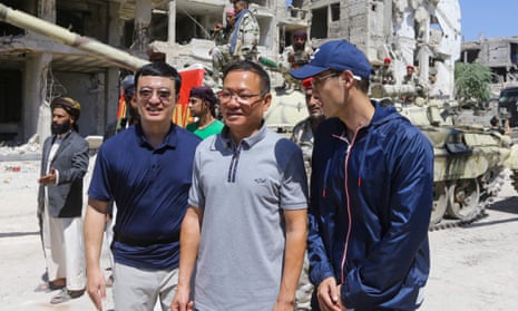 Chinese ambassador to Syria Feng Biao (centre) with film crew members in Al Hajar al-Aswad in Syria.