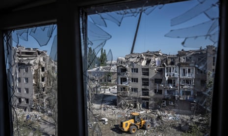 View of destroyed building in Pokrovsk from shattered window of another building
