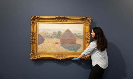 Claude Monet’s Meules, milieu du jour (Haystacks, midday), being hung at the Tweed Regional Gallery and Margaret Olley Art Center on Wednesday.