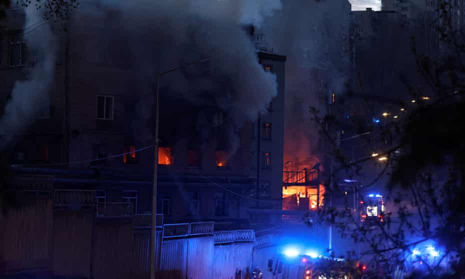 Fire burns in a building after Russia attacked Kyiv with two cruise missiles on Thursday evening.