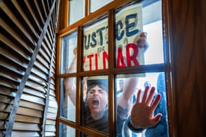 Protesters outside a window