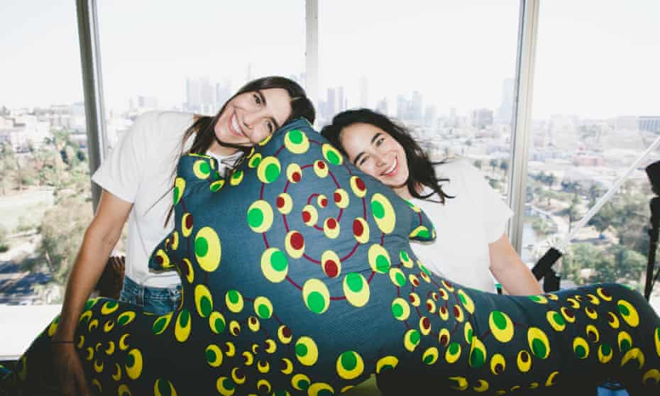 Iris Alonzo and Carolina Crespo from Everybody, with their body pillow, designed by art collector Jean Pigozzi.