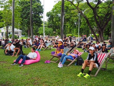 Participants sit back at the ‘just sitting and not doing shit’ event.