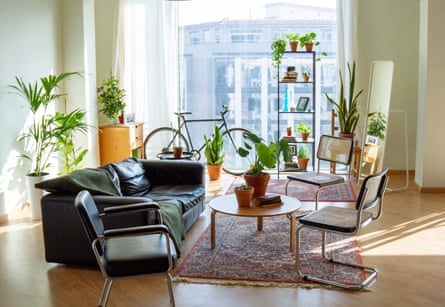 Interior of an apartment with sofa, coffee table and three chairs
