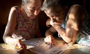 ‘It’s hard to imagine they’ll one day be gone’ … the sisters complete a crossword in an image from the photobook Aunties. All photographs: Nadia Sablin