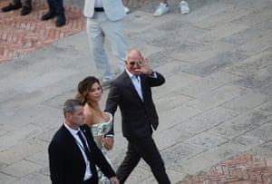 Jeff Bezos and Lauren Sánchez walk together on the eve of their wedding day