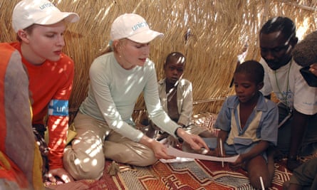 With his mother Mia on a Unicef mission to Sudan in 2004.