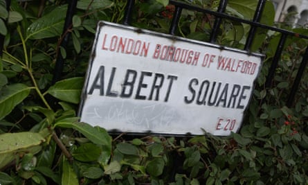 Sign for Albert Square among leaves