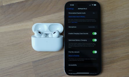 The AirPods Pro next to an iPhone showing the settings pane.
