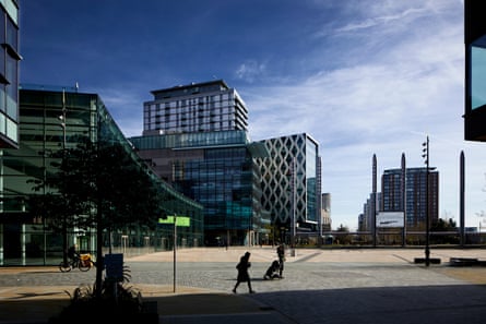 Modern buildings across a large square at Mediacity at the Salford Quays docklands.