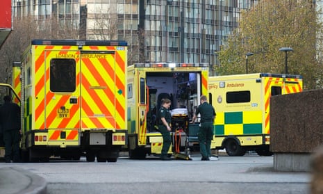 Ambulances and paramedics outside a hospital