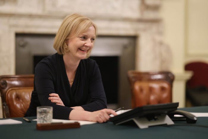 Liz Truss at work in the cabinet room yesterday.