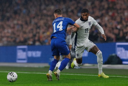 Marcus Rashford charges down the wing for England.
