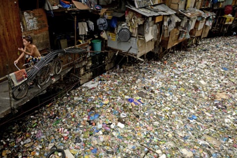 A river full of rubbish flows through a shanty town in Manila. Incoming President Rodrigo Duterte yesterday pledged to spread economic activity beyond the overpopulated capital and said he would not allow any more factories to be built there